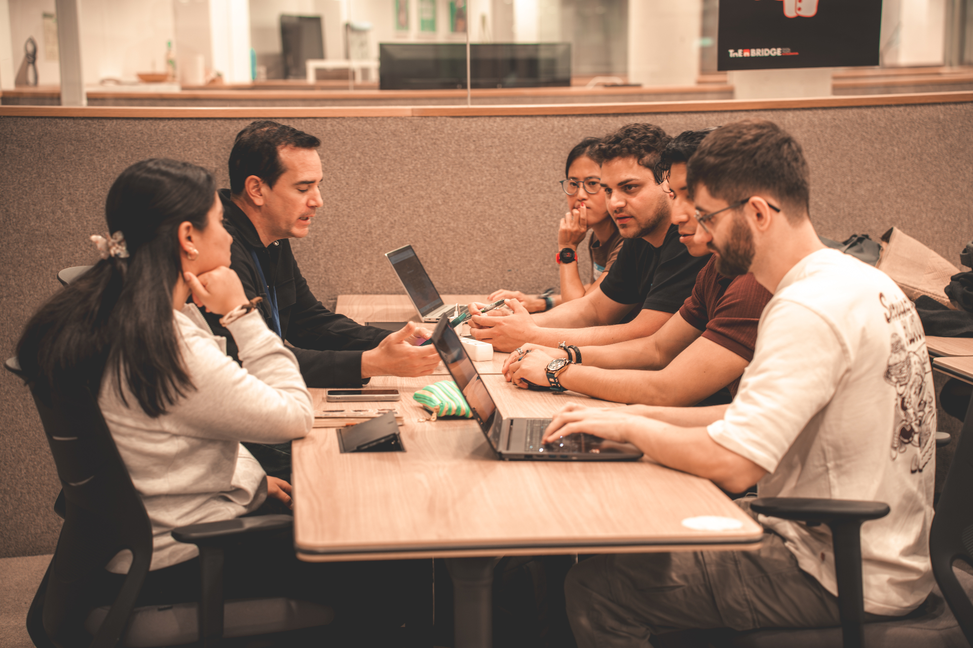 Participants working at The Bridge