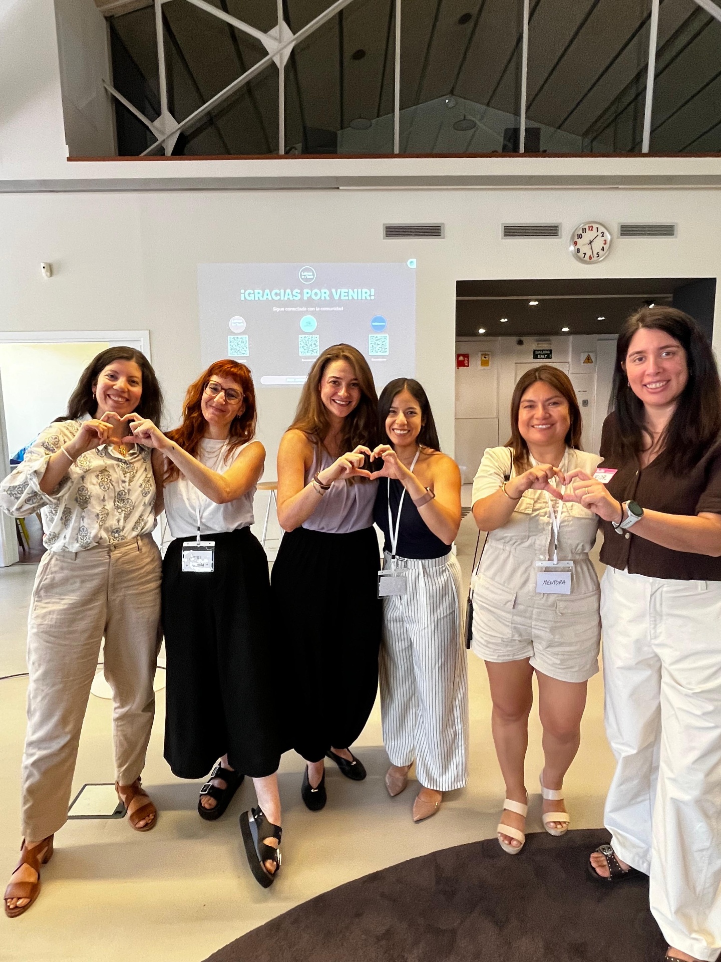 Participants forming hearts at Runroom