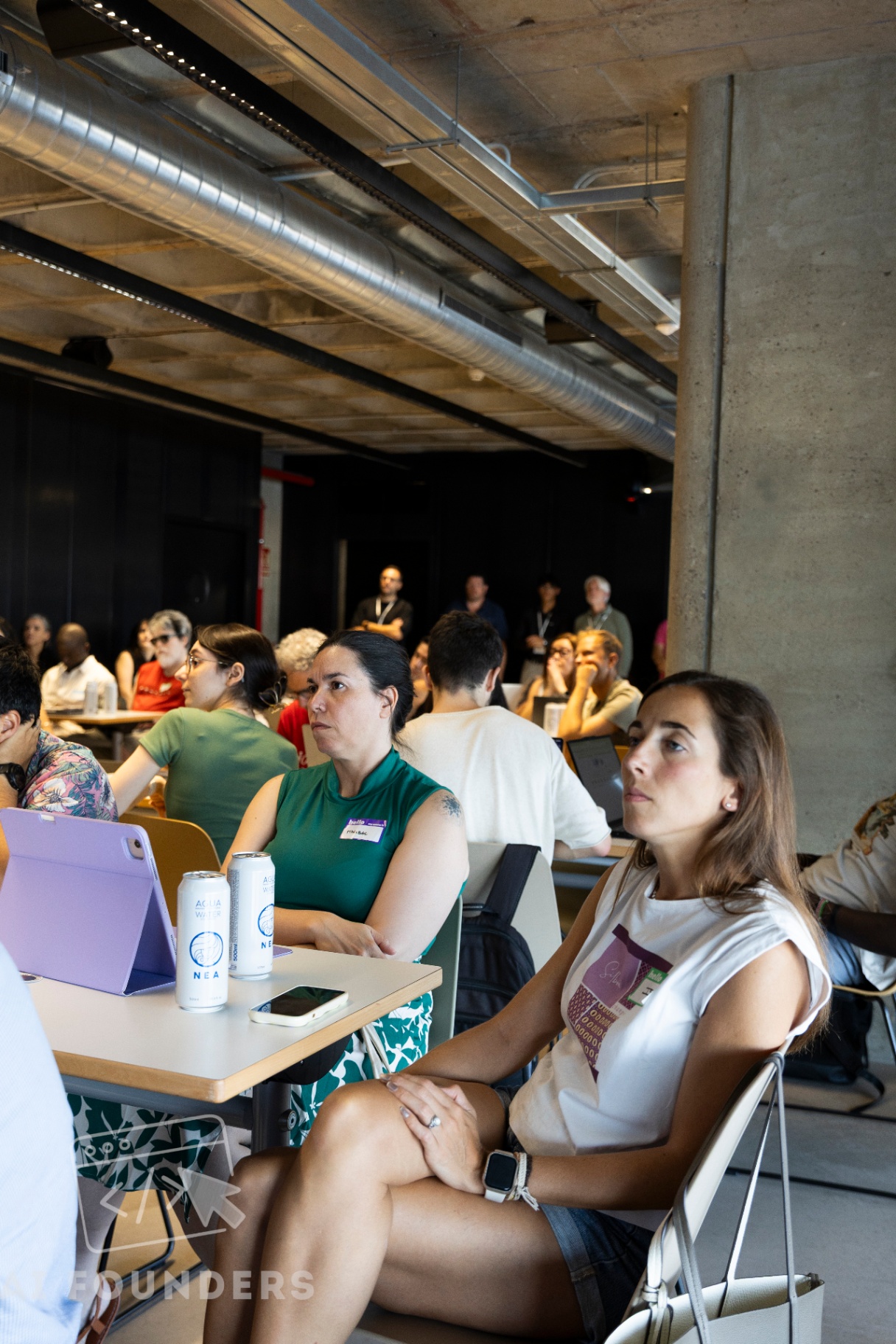 Attendees listening to the session