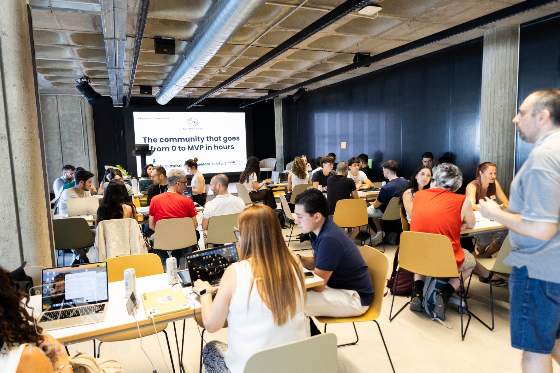 A packed room of participants at The Terminal Hub